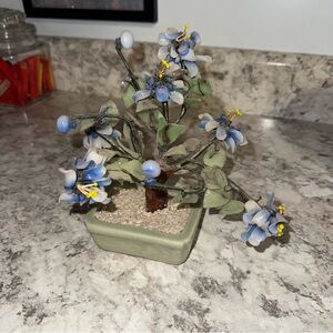 This is a vintage jade glass bonsai tree sculpture in a celadon ceramic planter